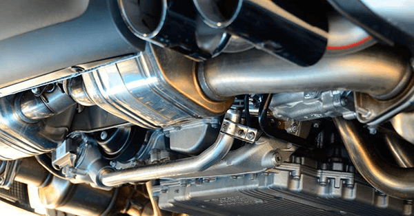 How does a resonator fit into an exhaust system?