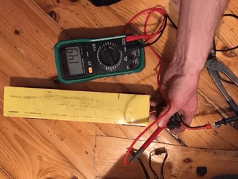 Steps for using a multimeter to test voltage of a live wire